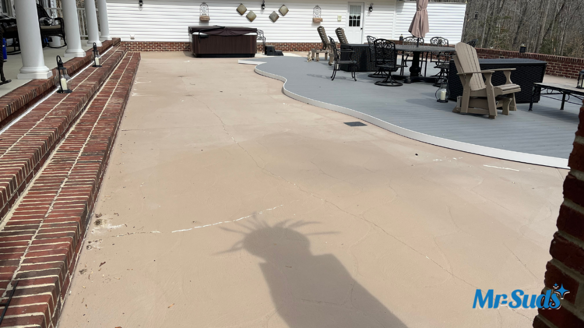 Professional soft washing a slippery concrete pool deck in Hartford CT to remove algae, biofilm, and restore safe, non-slip traction around the swimming pool.