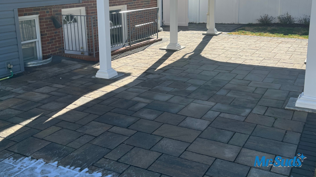 Professional soft washing a slippery concrete pool deck in Hartford CT to remove algae, biofilm, and restore safe, non-slip traction around the swimming pool.