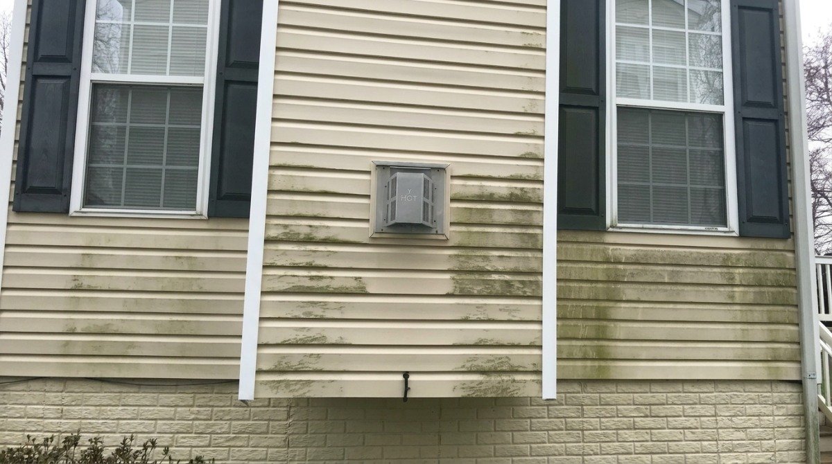 Tree shade keeping north-facing house siding damp in Newington Connecticut