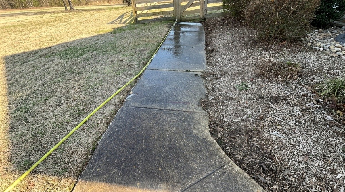 Property manager reviewing an HOA pressure washing contract and site map.