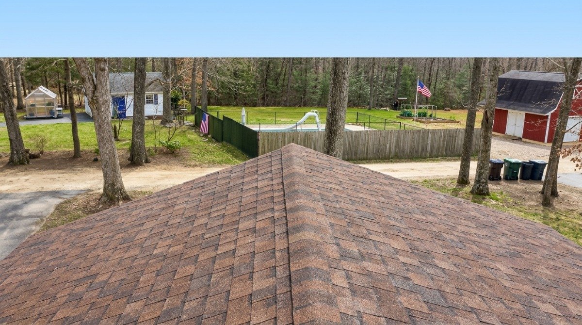 Black algae streaks on asphalt shingles of a Newington CT home